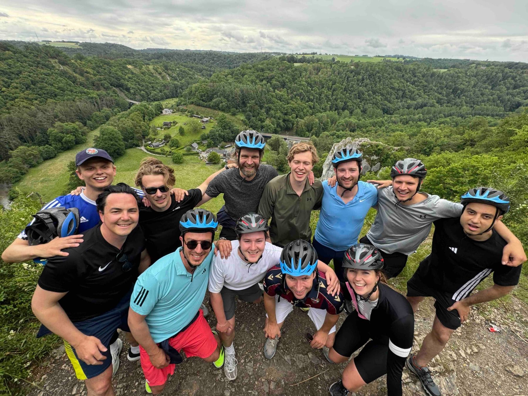 Team bike ride on the cliff